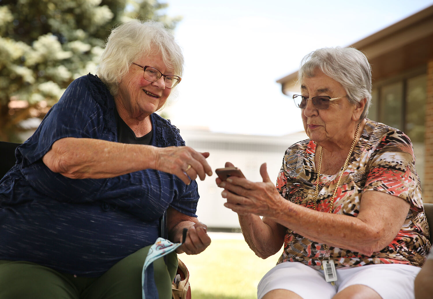 Dawna Jacobs, left, and Alberta Golden look at photos Dawna took of a recent Polo match